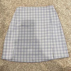 never worn plaid skirt with a blue zipper opening and two small front slits